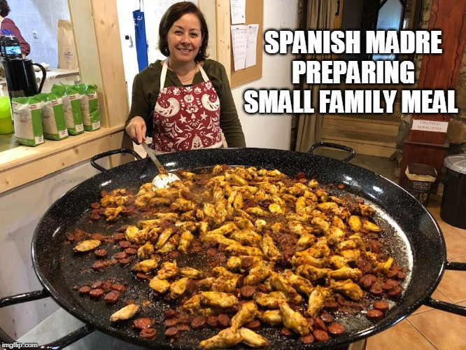 Spanish madre preparing small family meal